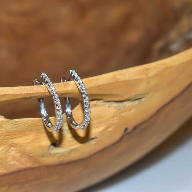Diamond hoop earrings set in 14k white gold