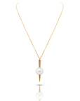 Qlassico pendant necklace from the Celestial Capsule, featuring a round Akoya pearl set in 18K yellow gold with a sculptural pointed design.