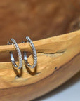 Diamond hoop earrings set in 14k white gold