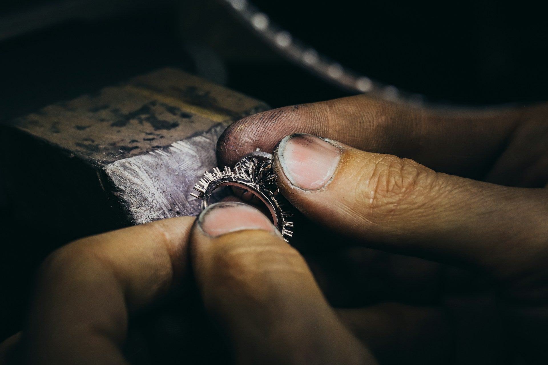 Close-up of hands crafting a fine jewellery piece.