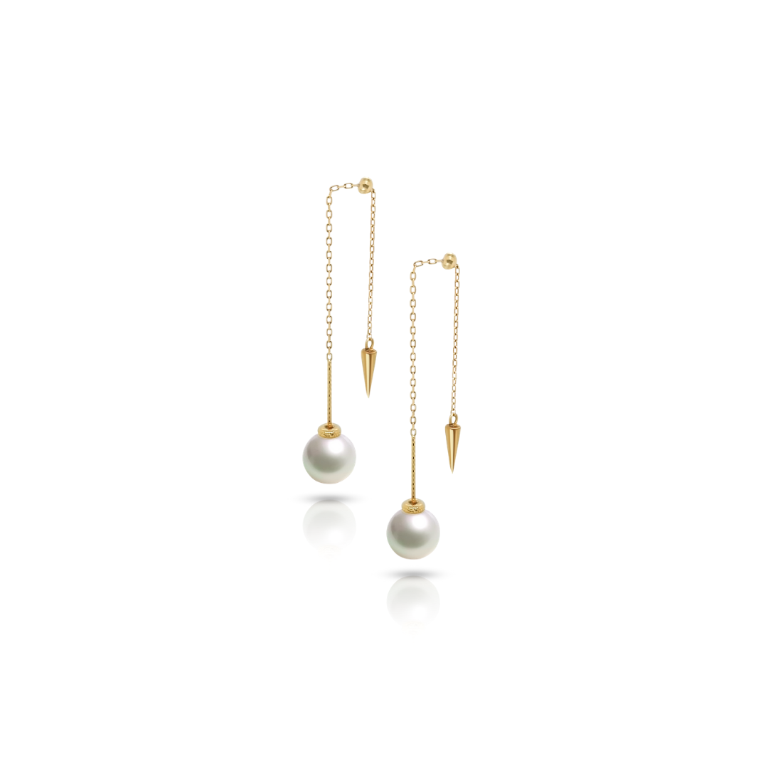 Qlassico dangling earrings from the  Celestial Capsule, featuring a pair of round Akoya pearls set in 18K yellow gold.