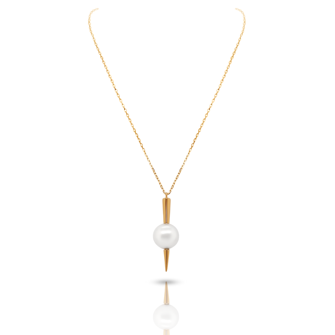 Qlassico pendant necklace from the Celestial Capsule, featuring a round Akoya pearl set in 18K yellow gold with a sculptural pointed design.